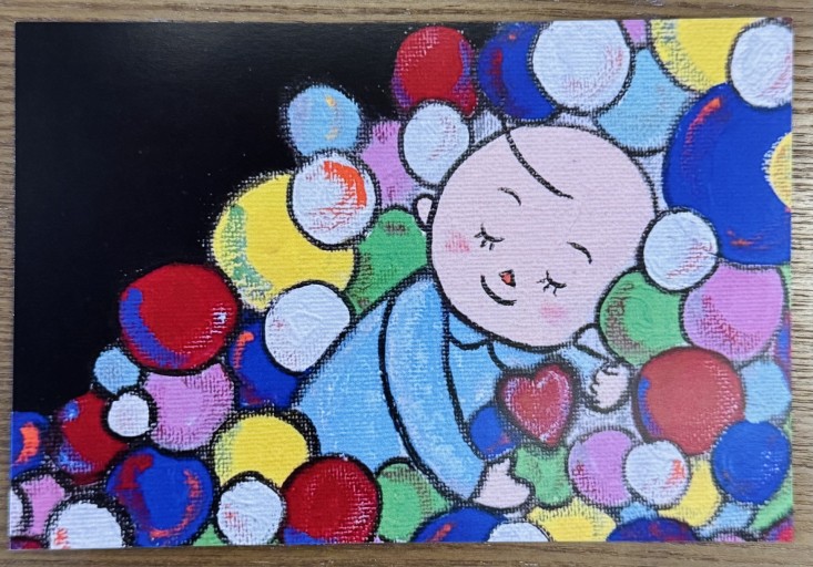 ポストカード「Sleeping in a ball pit」 - ひとつぶ本棚